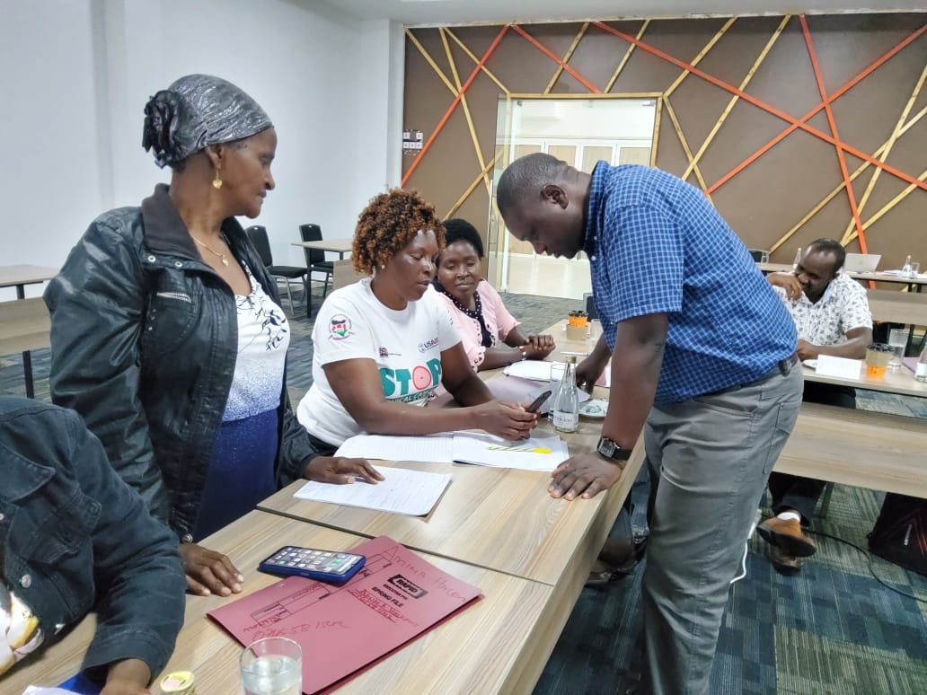 Field researchers conducting community interviews